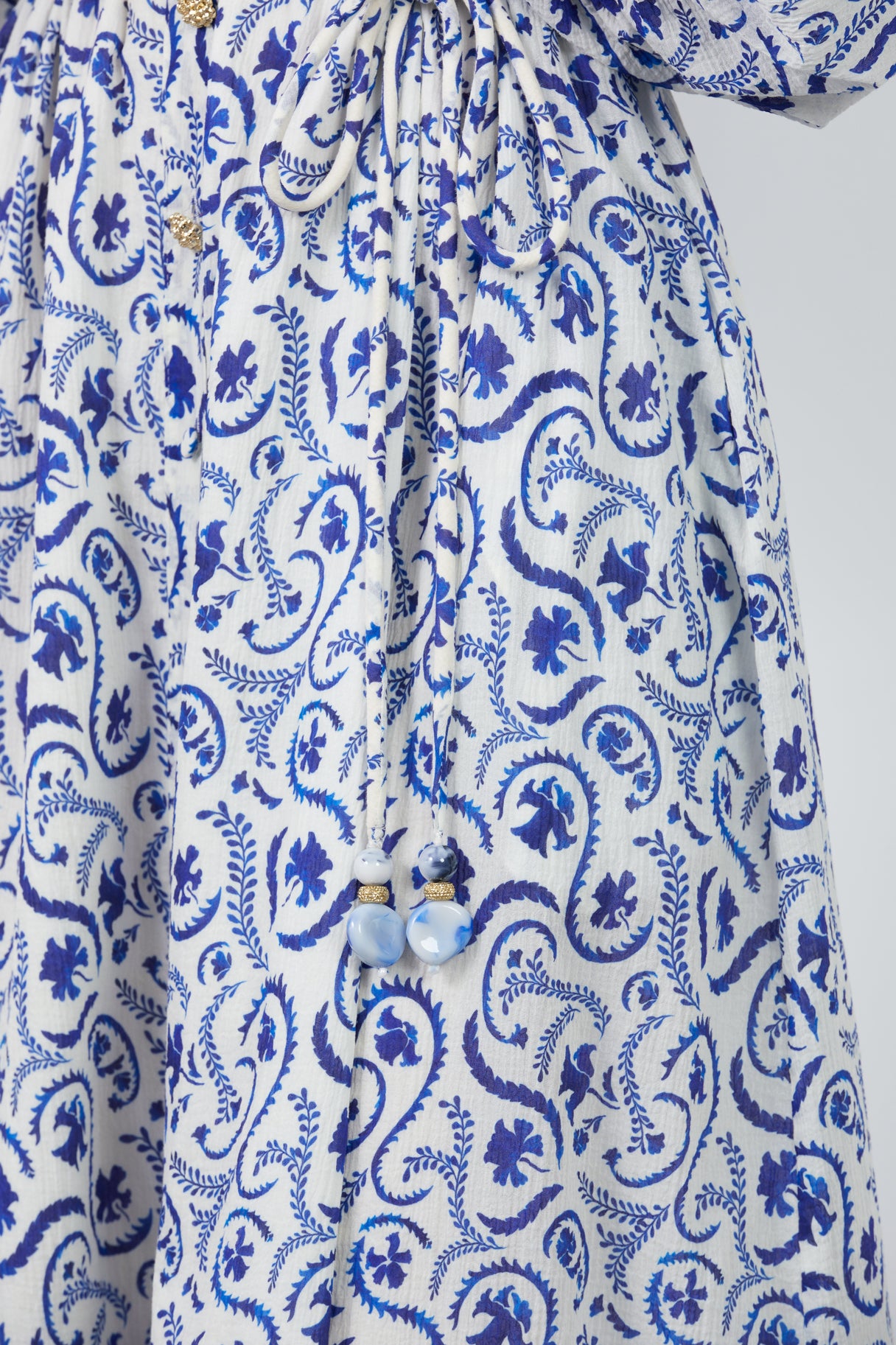 Kordon Detaylı Desenli Kayık Yaka Düşük Kol Uzun Elbise